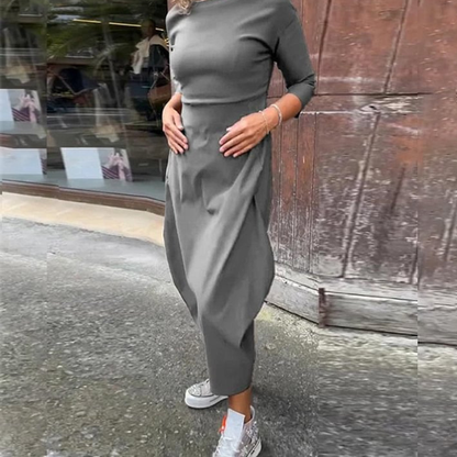 Elegantiška ilga liekninanti suknelė su kišenėmis