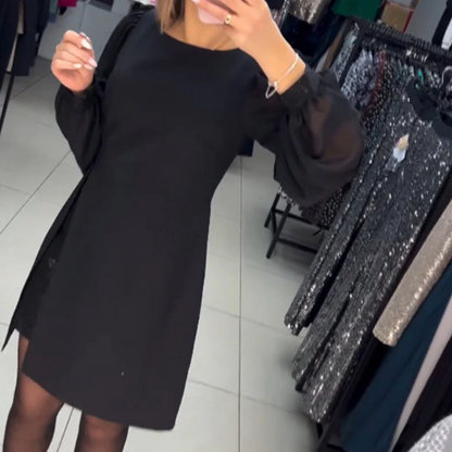 A formos suknelė su pūstomis rankovėmis ir skeltuku