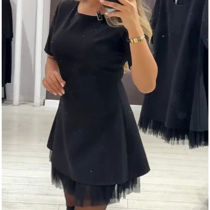 Elegantiška suknelė su žėrinčiu blizgučių raštu