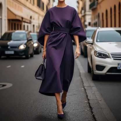 Elegantiška ilga suknelė su pūstomis rankovėmis ir dirželiu
