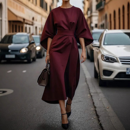 Elegantiška ilga suknelė su pūstomis rankovėmis ir dirželiu