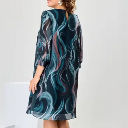 Elegantiška raštuota suknelė su skeltuku
